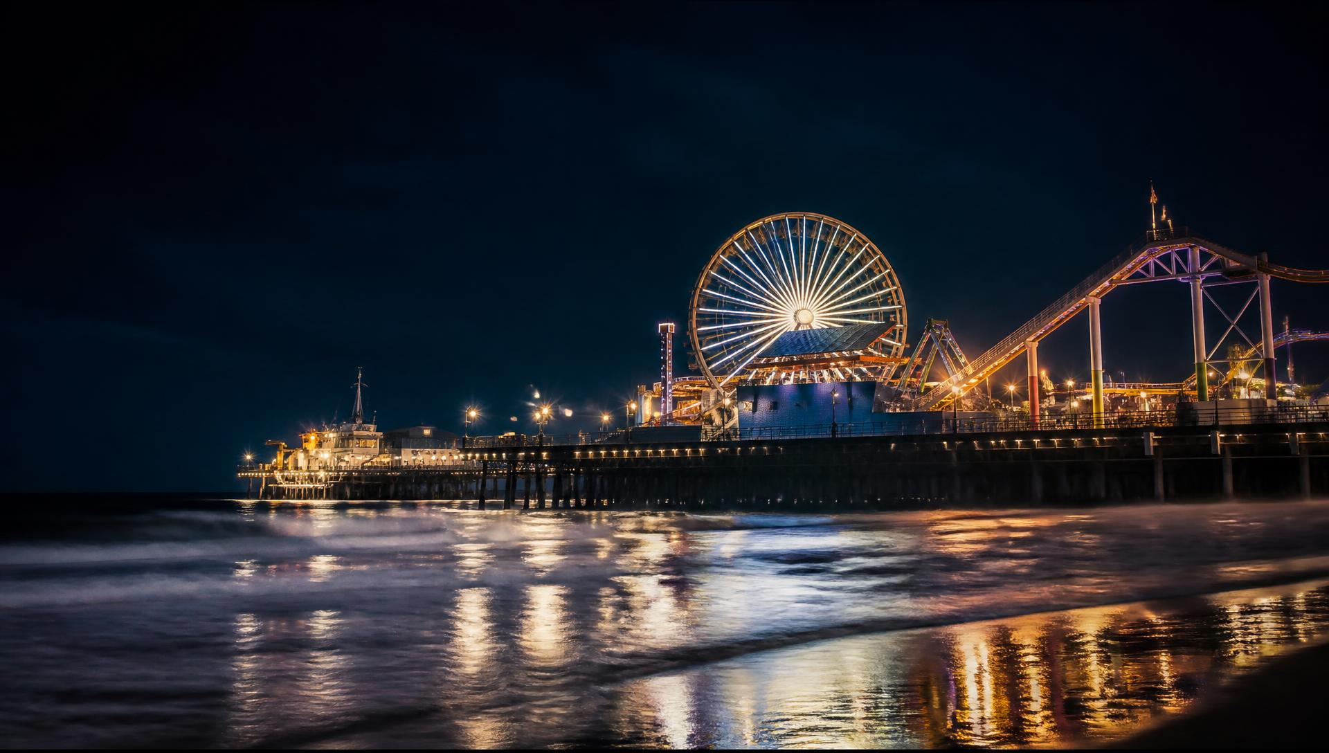 The Los Angeles coastline lit at night above the Pacific Ocean